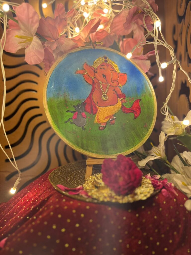 Handcrafted Pichwai painting of Lord Ganeshji adorned with intricate beadwork, fabric detailing, and traditional motifs.