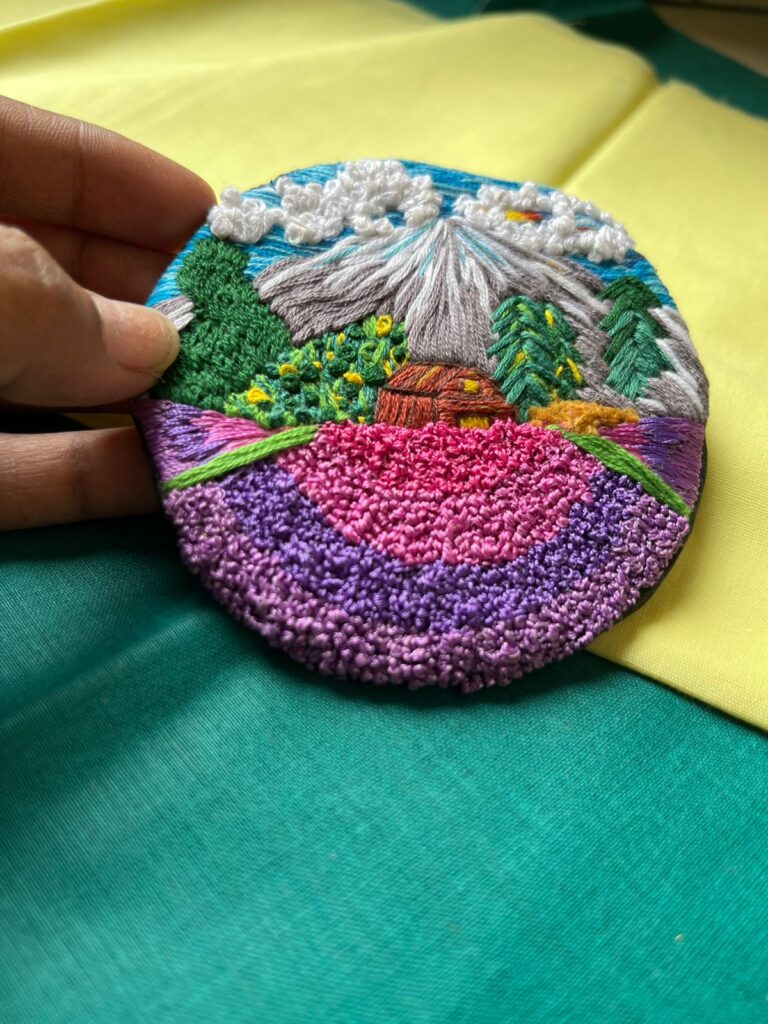 a unique wall decor hand embroidered gift of a snowy village